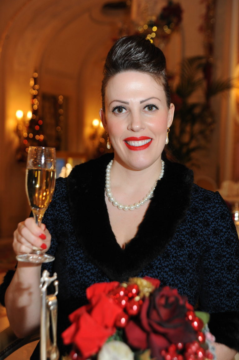 Miss Windsor's Delectables - Christmas Afternoon Tea at The Ritz, London. A glass of Reserve Ritz Champagne Barons De Rothschild. Vintage dress by Collectif.