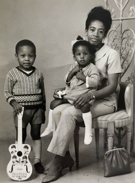 Miss Windsor: Windrush - Circa 1968 - Valerie Wallace with son Michael & holding her darling daughter Sharron.