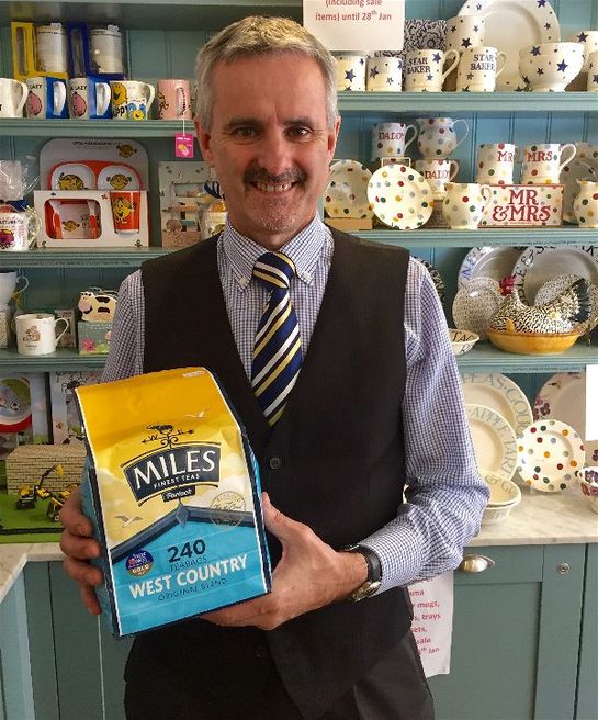 Miss Windsor's Delectables - Mr Colin Barrell - Mr Miles Tearooms, Taunton, Somerset. Holding a bag of Miles West-Country Original Blend Tea! 